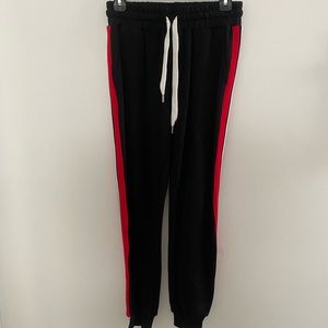Black jogger sweatpants with red and white stripe